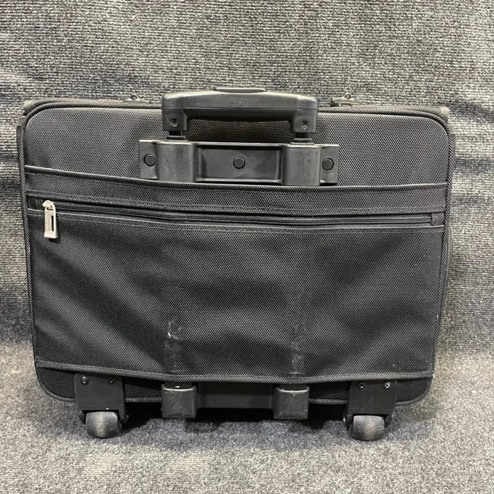 US Luggage New York Black Ballistic Nylon Rolling Catalog Case Wheeled Briefcase